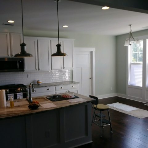 Dark Island and White Kitchen Cabinets