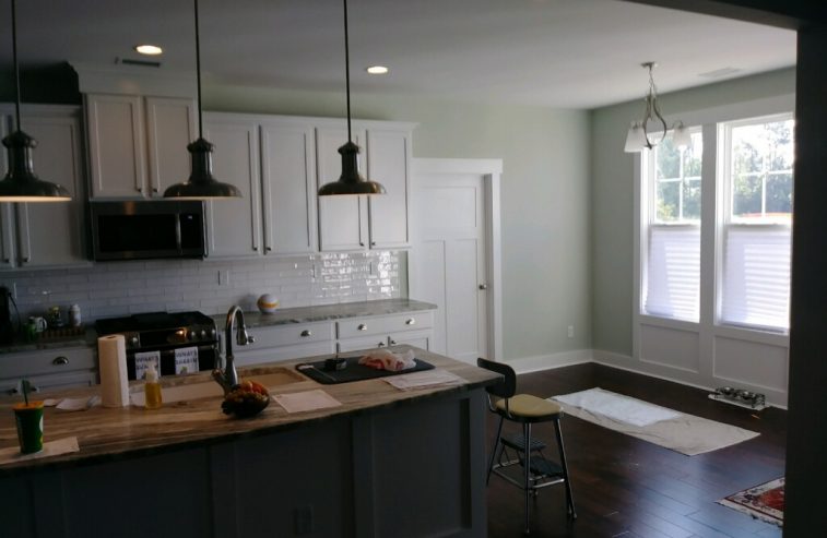 Dark Island and White Kitchen Cabinets